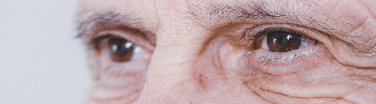Close up of the eyes, detail and wrinkles of a senior male, aging vision issues concept