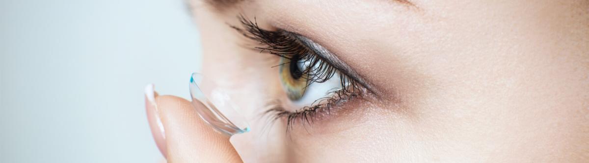 close up of a female putting in her contact lenses